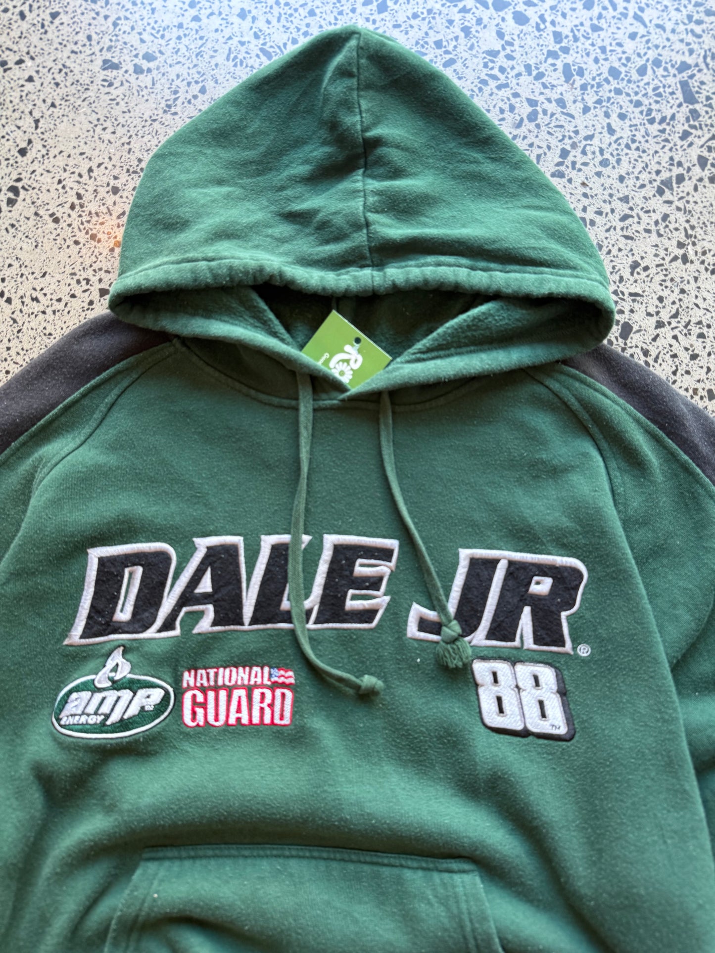 2008 NASCAR Dale Jr number 88 two-tone hoodie XL laid flat on polished concrete background, vintage racing hoodie with bold graphics and colour block design.