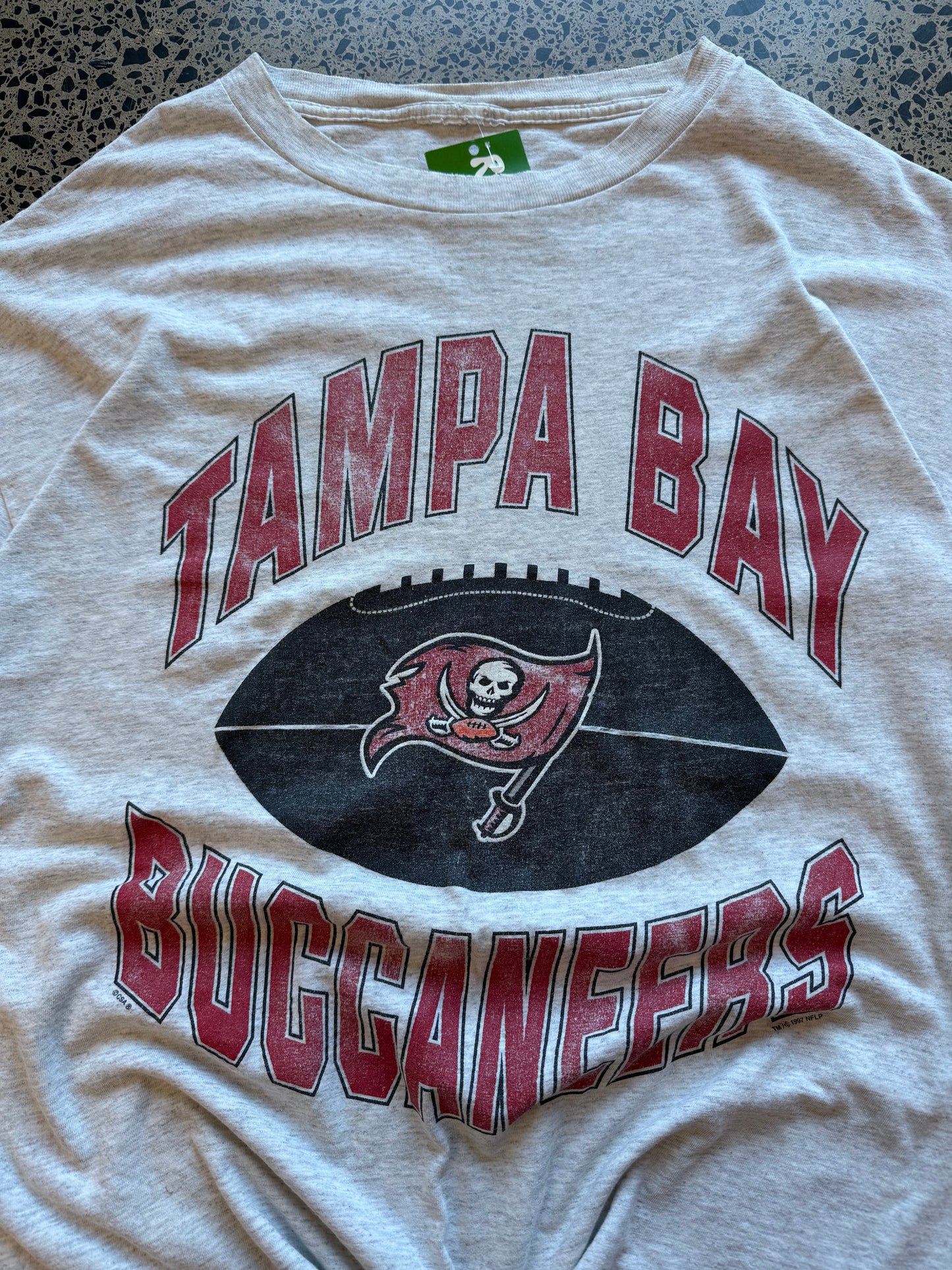 Vintage 1997 Tampa Bay Buccaneers red t-shirt with helmet and team graphic. Size L. NFL football memorabilia.