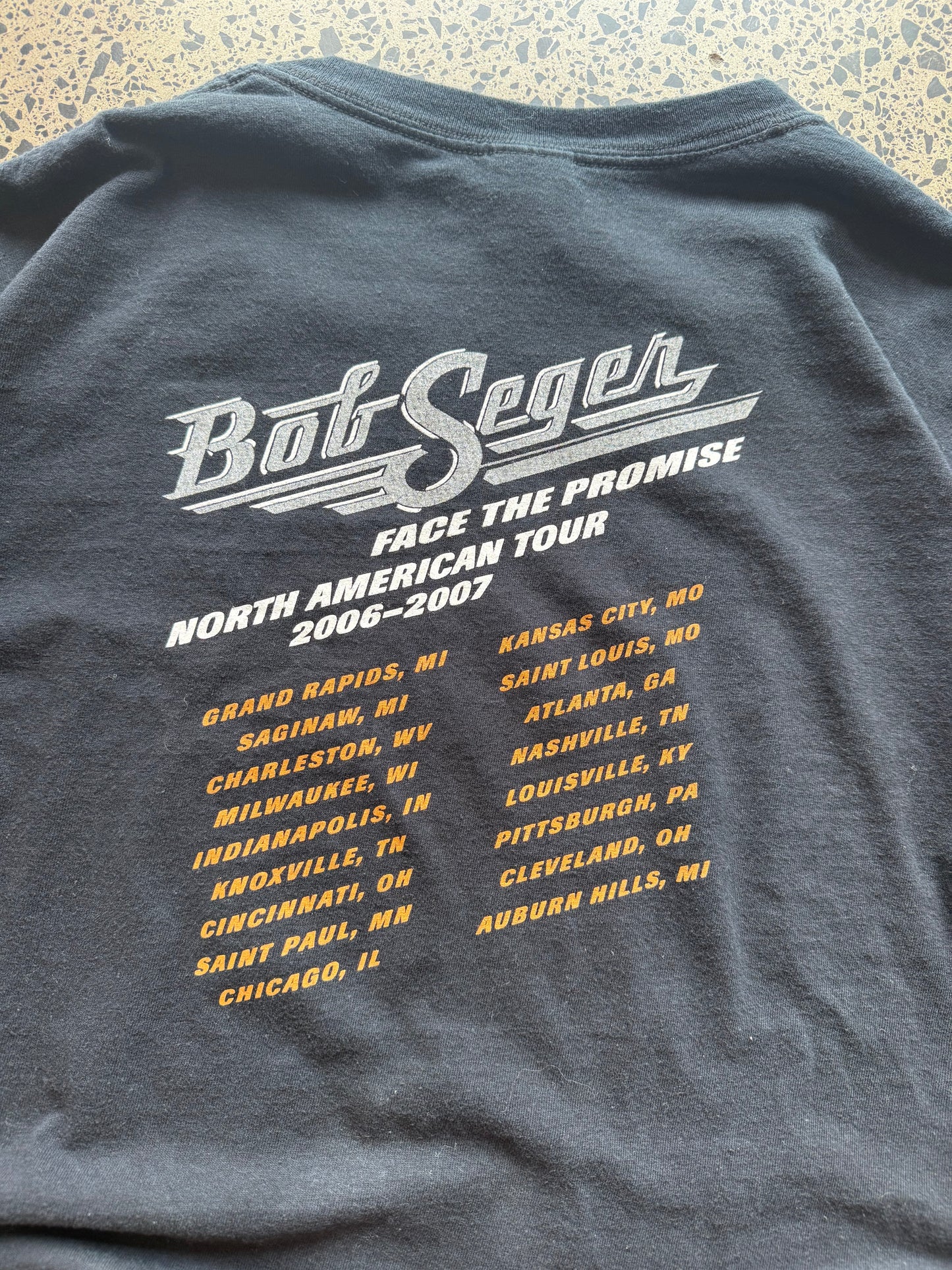 2006/07 Bob Seger North America tour t-shirt size 2XL laid flat on polished concrete background, vintage band tee with tour graphics and relaxed oversized fit.