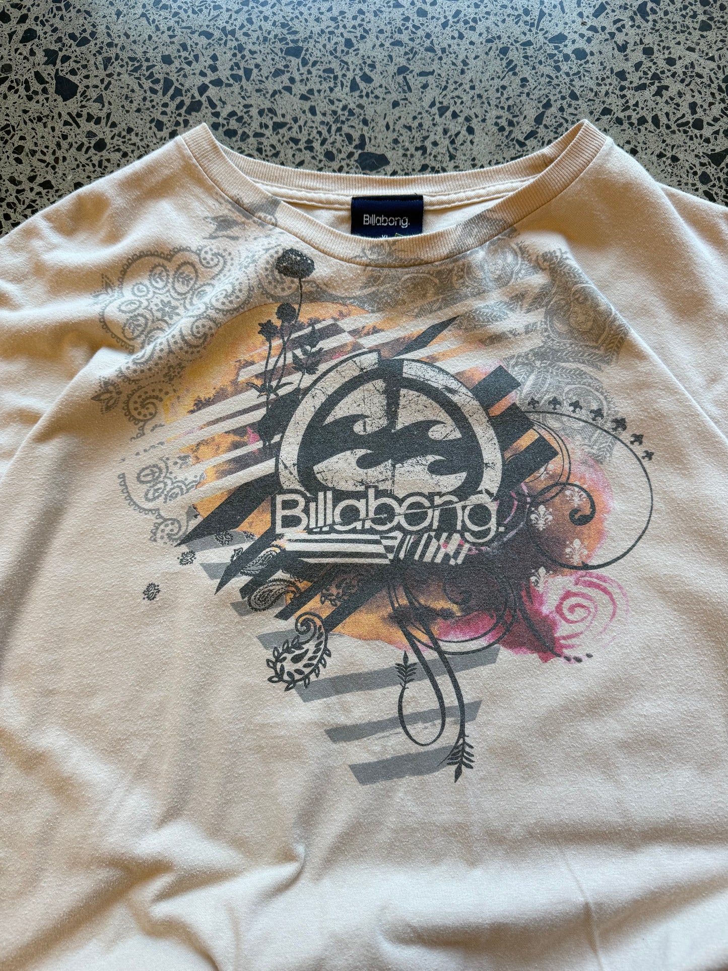 Y2K Billabong black t-shirt with bold surf-inspired front graphic. Size XL. Vintage surf streetwear.