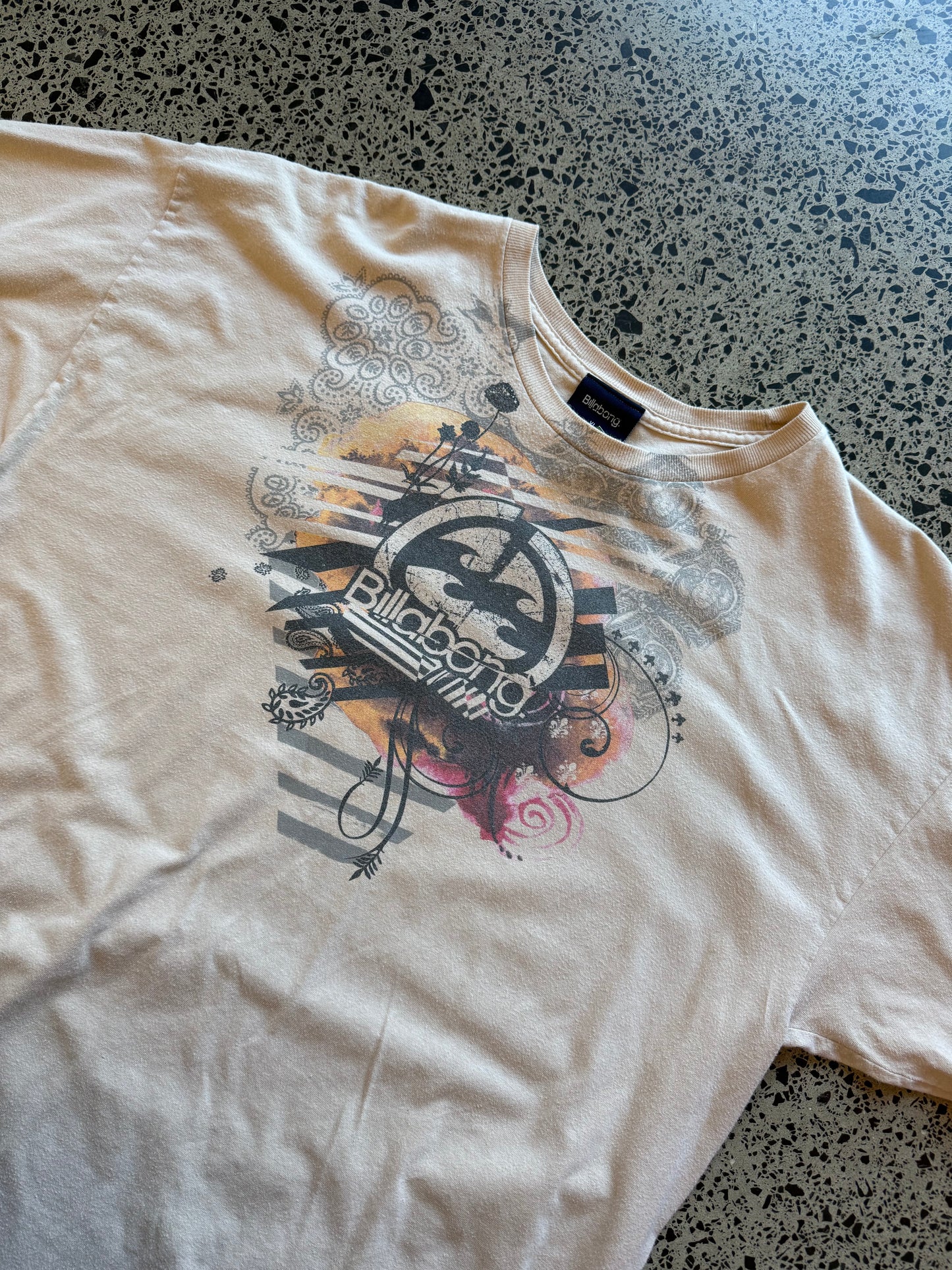 Y2K Billabong black t-shirt with bold surf-inspired front graphic. Size XL. Vintage surf streetwear.
