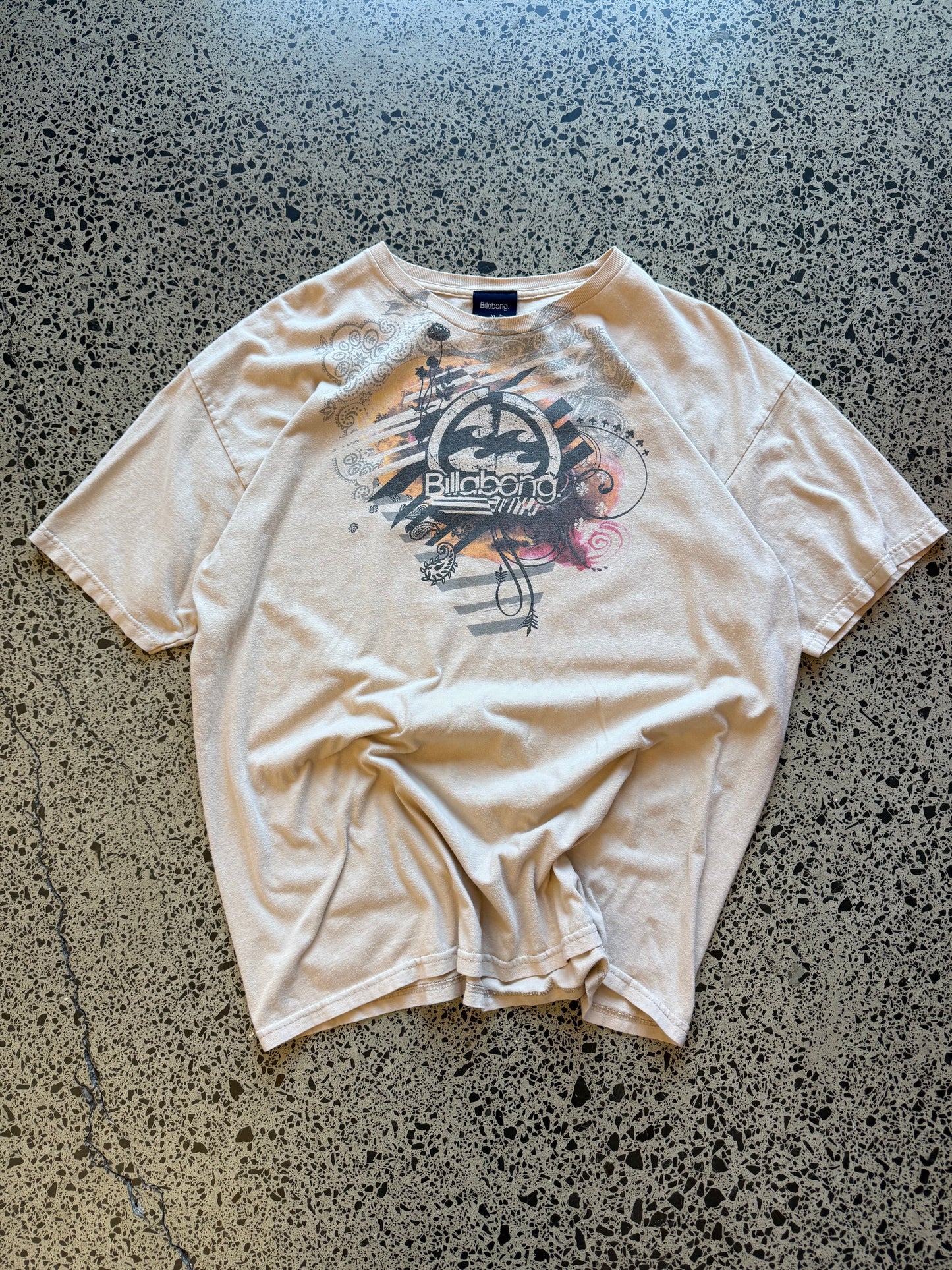 Y2K Billabong black t-shirt with bold surf-inspired front graphic. Size XL. Vintage surf streetwear.