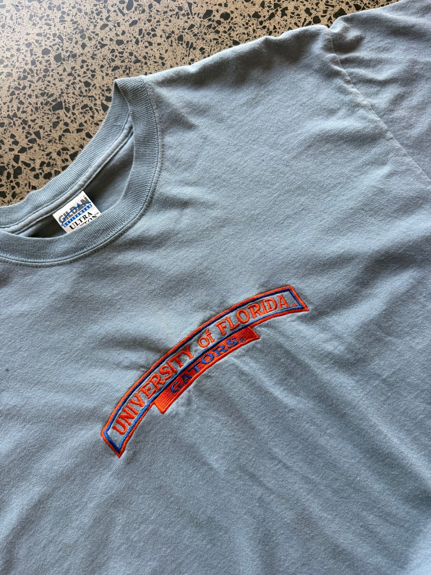 Vintage blue University of Florida Gators t-shirt with bold graphic, size L, laid flat on white background