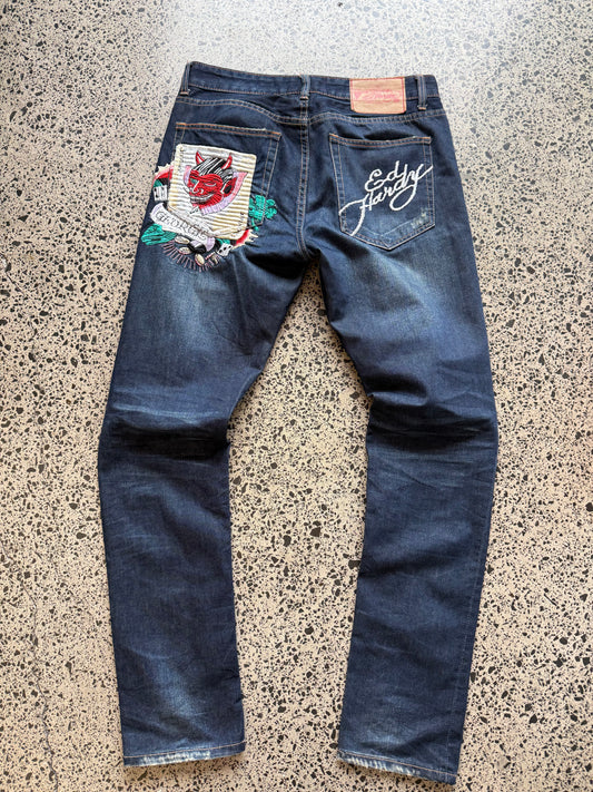 Y2K Ed Hardy embroidered dark blue jeans with devil joker playing card graphics. Size W32 L33.