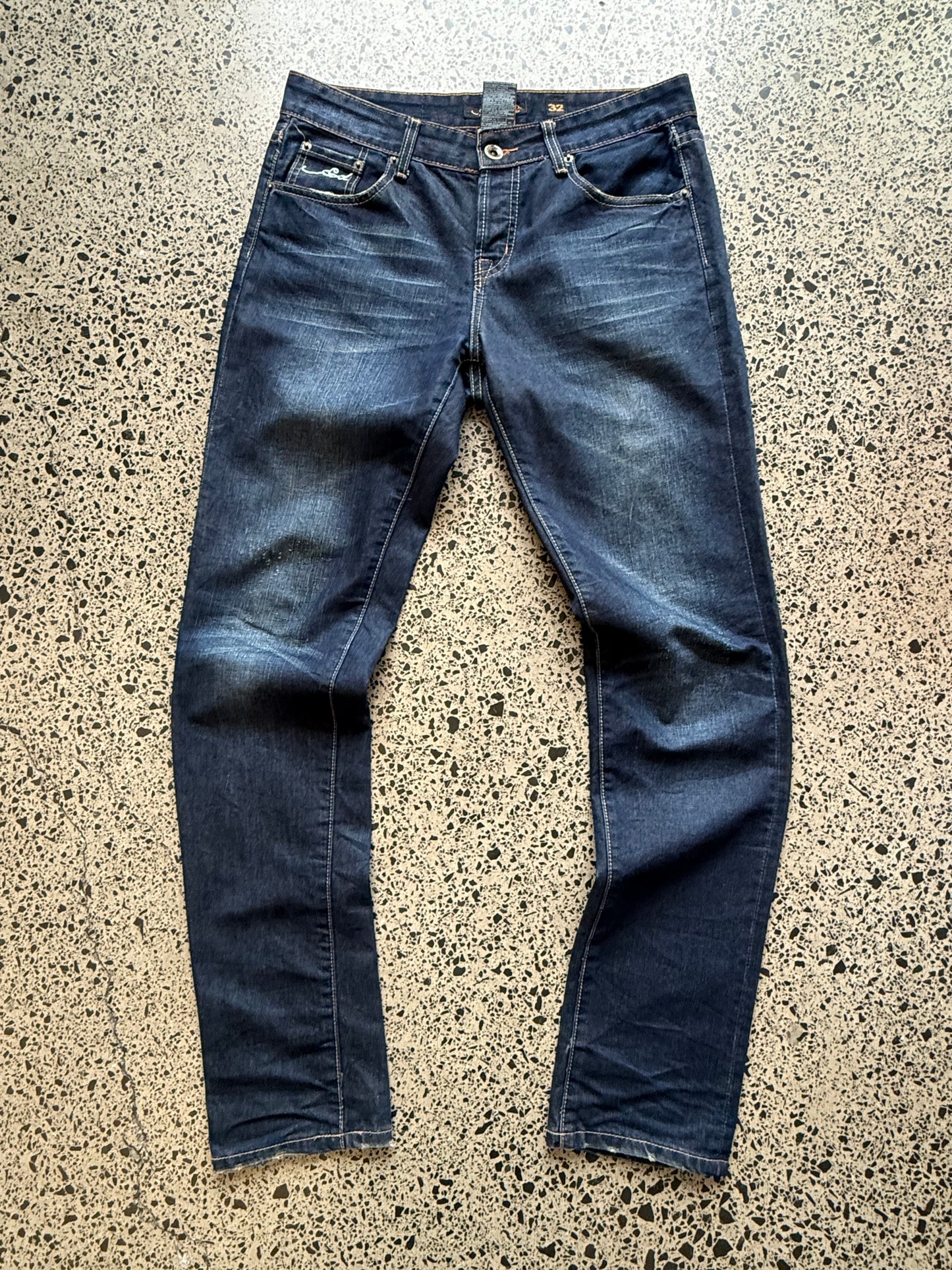 Y2K Ed Hardy embroidered dark blue jeans with devil joker playing card graphics. Size W32 L33.