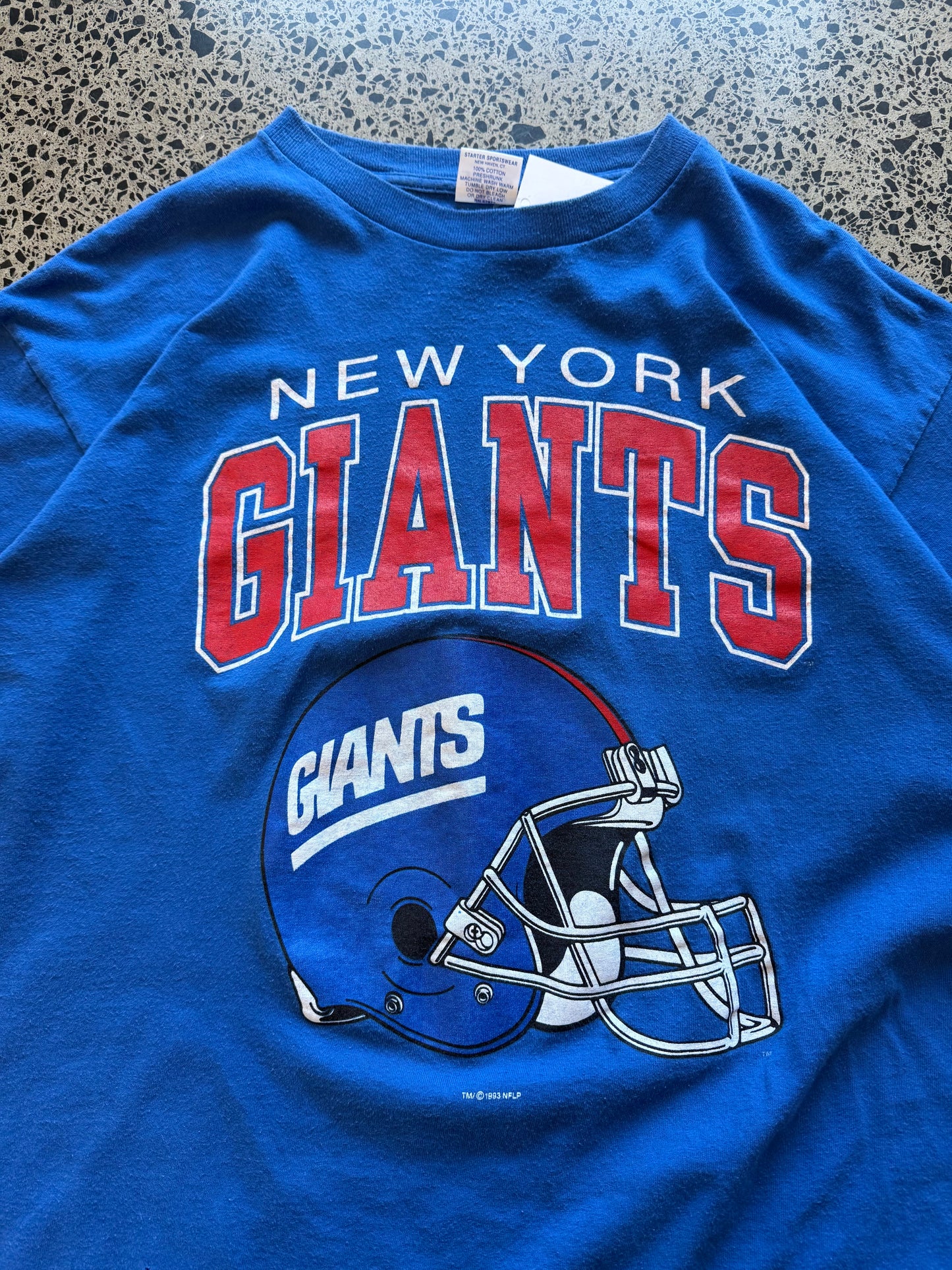 Vintage 90s New York Yankees navy t-shirt with bold “New York” chest graphic. Size XL. Classic NFL sportswear