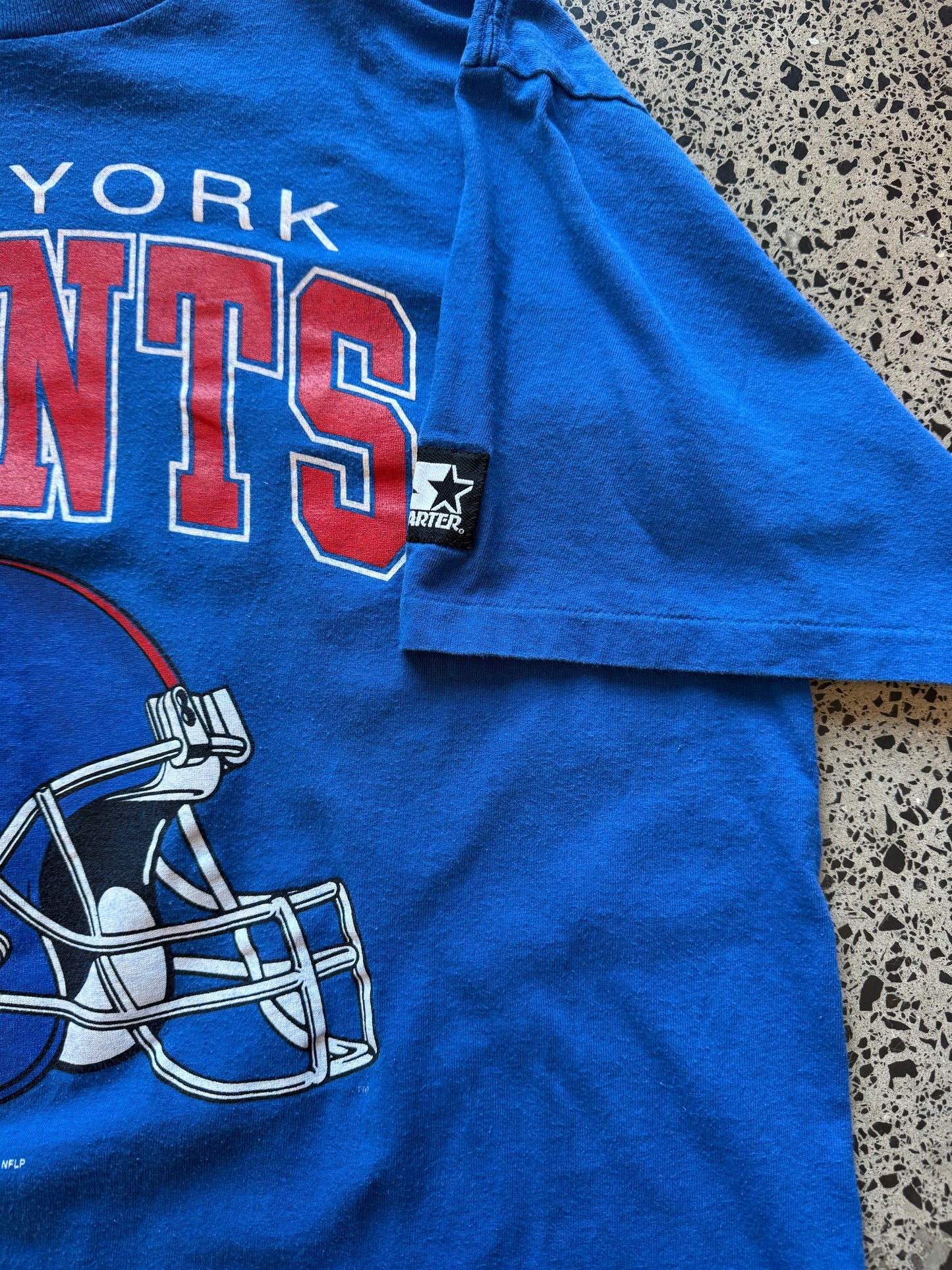 Vintage 90s New York Yankees navy t-shirt with bold “New York” chest graphic. Size XL. Classic NFL sportswear