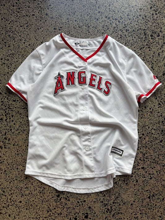 LA Angels Shohei Ohtani MLB baseball jersey size XL laid on polished concrete background — red with white detailing and Angels logo.