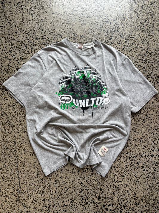 Ecko Unltd grey graffiti T-shirt, size 2XL, laid on polished concrete background — Y2K streetwear logo graphic on soft cotton.