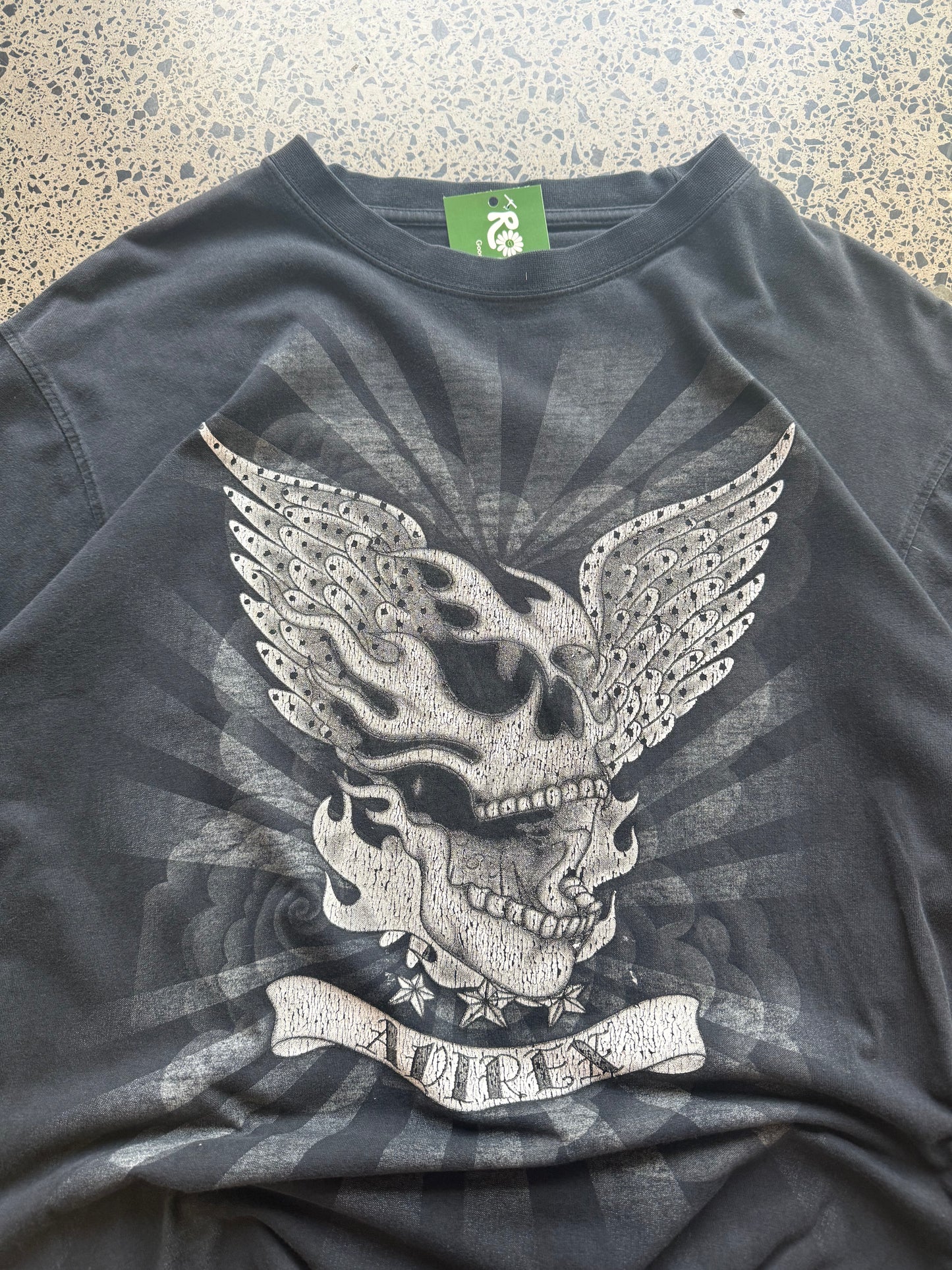 Black Affliction t-shirt with large winged skull graphic on front, size XL, laid flat on white background
