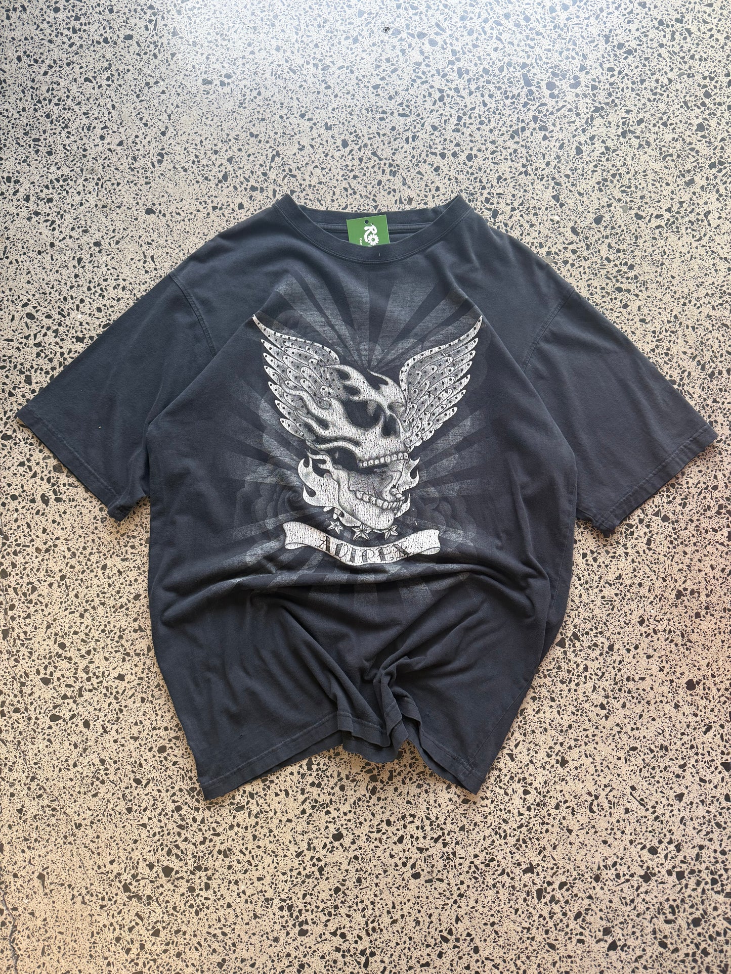 Black Affliction t-shirt with large winged skull graphic on front, size XL, laid flat on white background