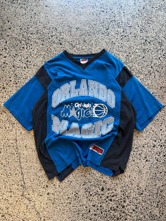 Vintage 90s NBA Orlando Magic black t-shirt with large front team logo graphic. Size XL. Basketball memorabilia