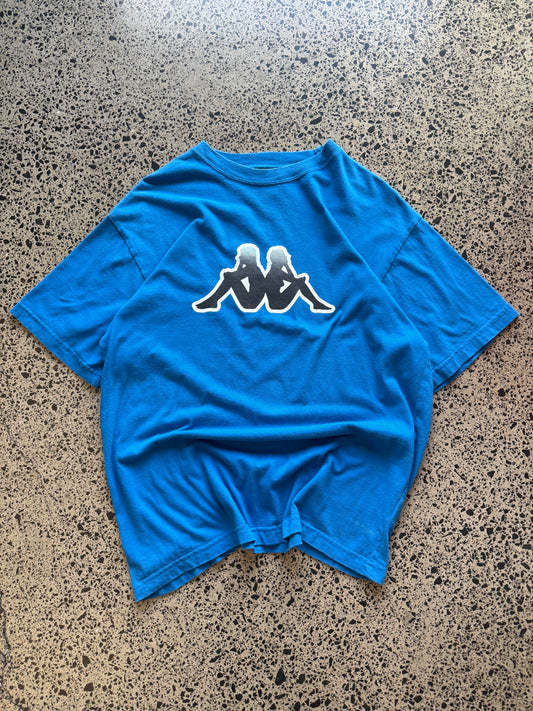 Blue Kappa t-shirt with large white logo graphic on front, size L, laid flat on white background