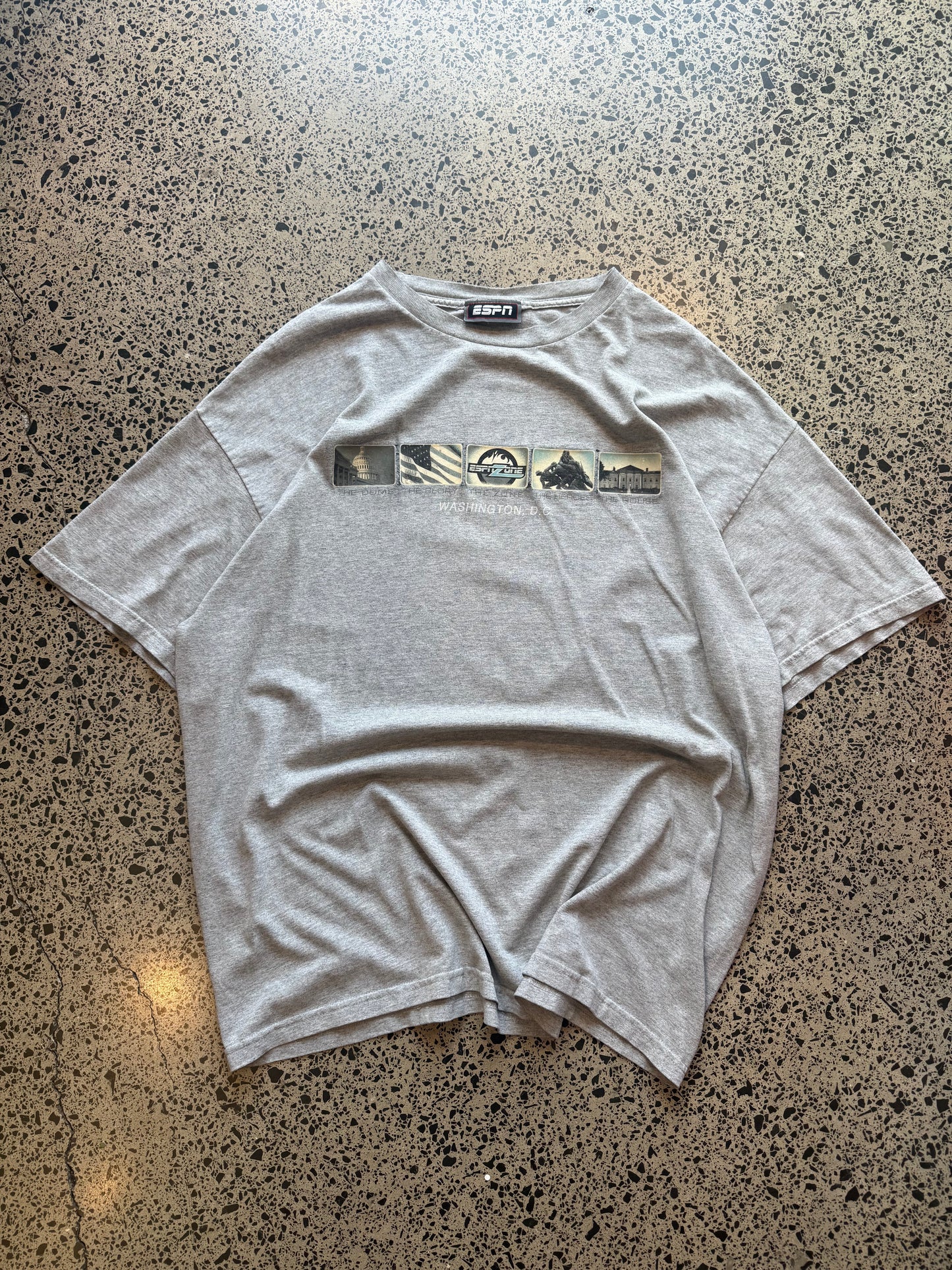 2000s ESPN graphic T-shirt, size XL, laid on polished concrete background — bold vintage ESPN logo on soft cotton.