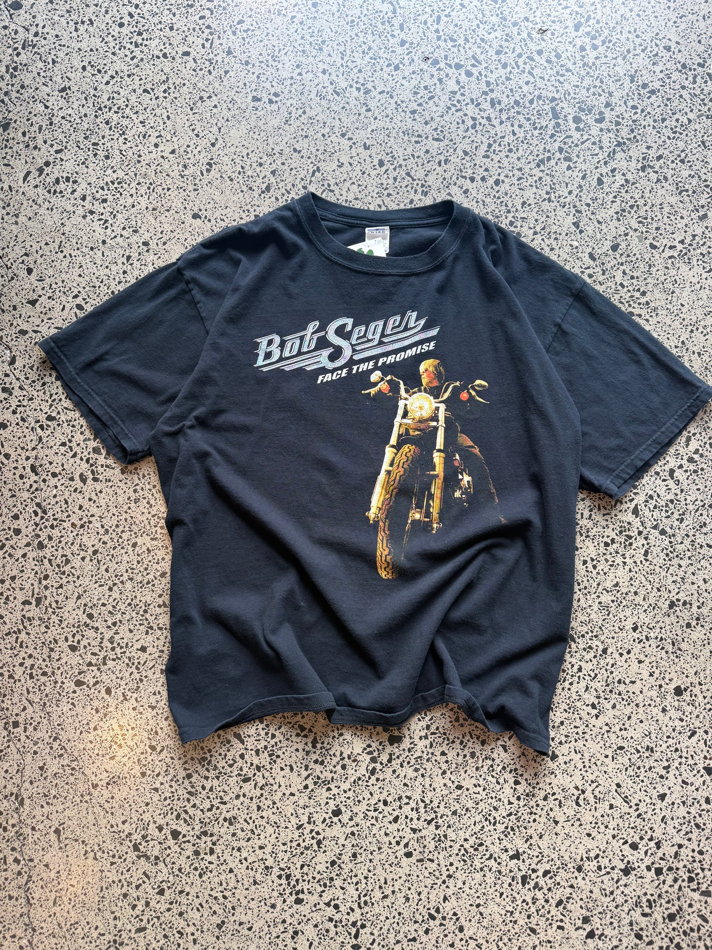 2006/07 Bob Seger North America tour t-shirt size 2XL laid flat on polished concrete background, vintage band tee with tour graphics and relaxed oversized fit.