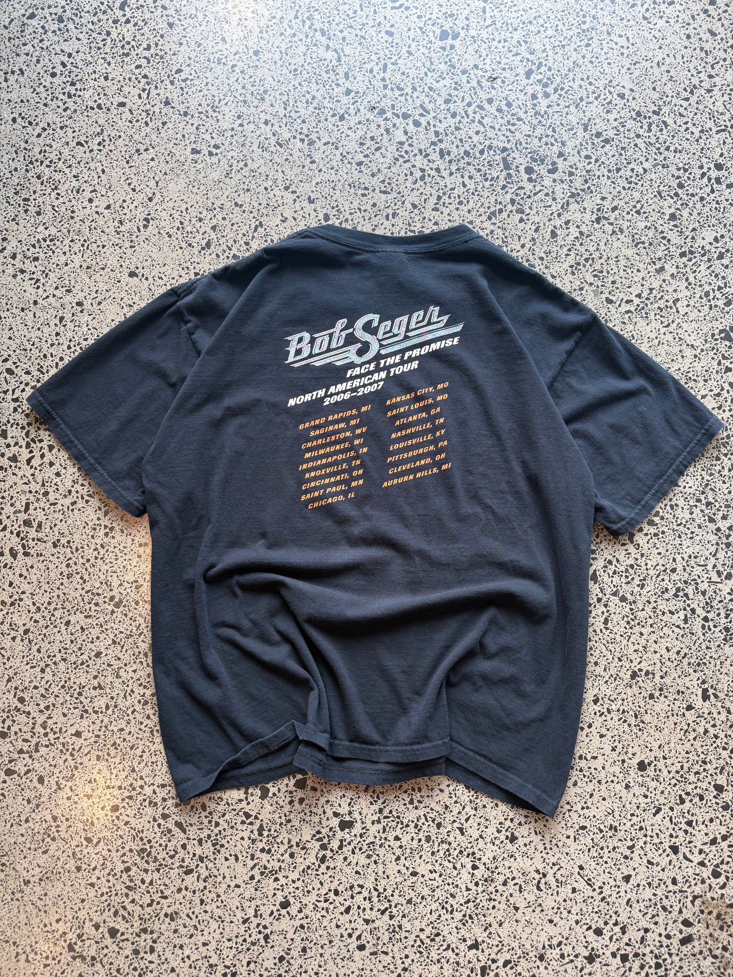 2006/07 Bob Seger North America tour t-shirt size 2XL laid flat on polished concrete background, vintage band tee with tour graphics and relaxed oversized fit.