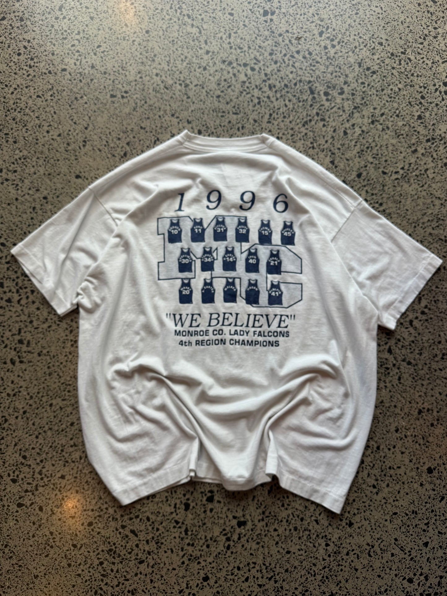 1996 Lady Falcons graphic T-shirt, size 2XL, laid on polished concrete background — soft vintage cotton with bold team print.