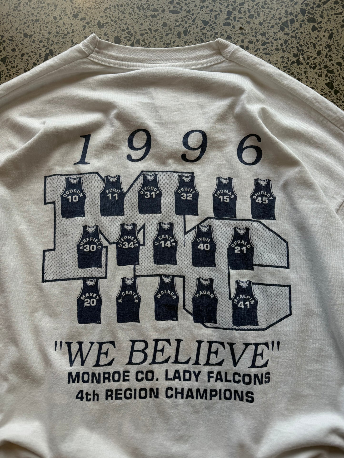 1996 Lady Falcons graphic T-shirt, size 2XL, laid on polished concrete background — soft vintage cotton with bold team print.