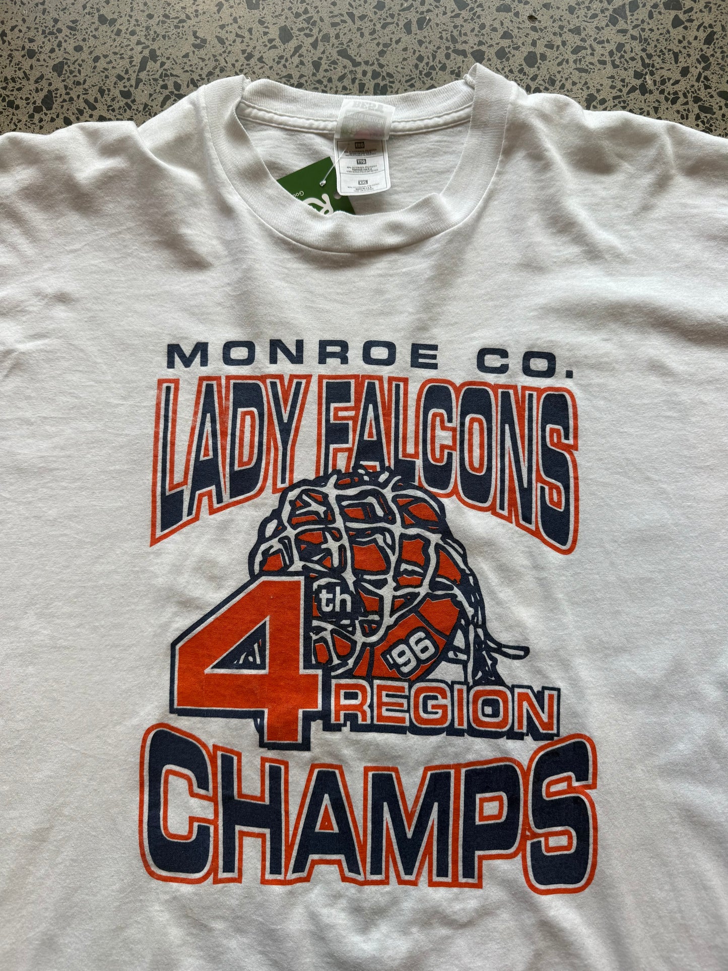 1996 Lady Falcons graphic T-shirt, size 2XL, laid on polished concrete background — soft vintage cotton with bold team print.