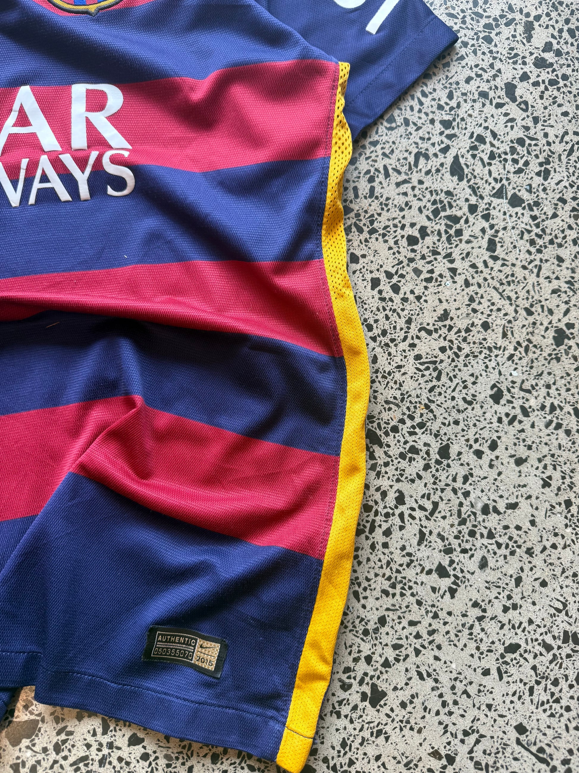 2015/16 FC Barcelona player issue football jersey in size L laid flat on a polished concrete background featuring the classic blue and red stripes.