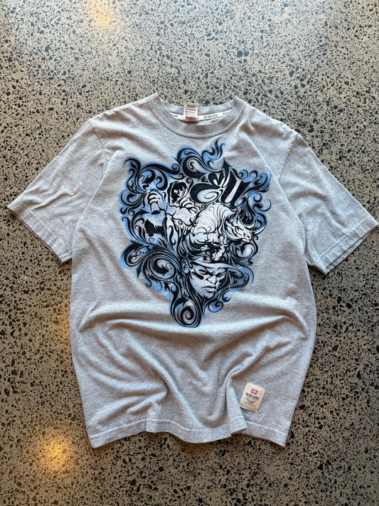 Ecko Unltd black graphic T-shirt in size L laid on a polished concrete background with large rhino logo on the front.