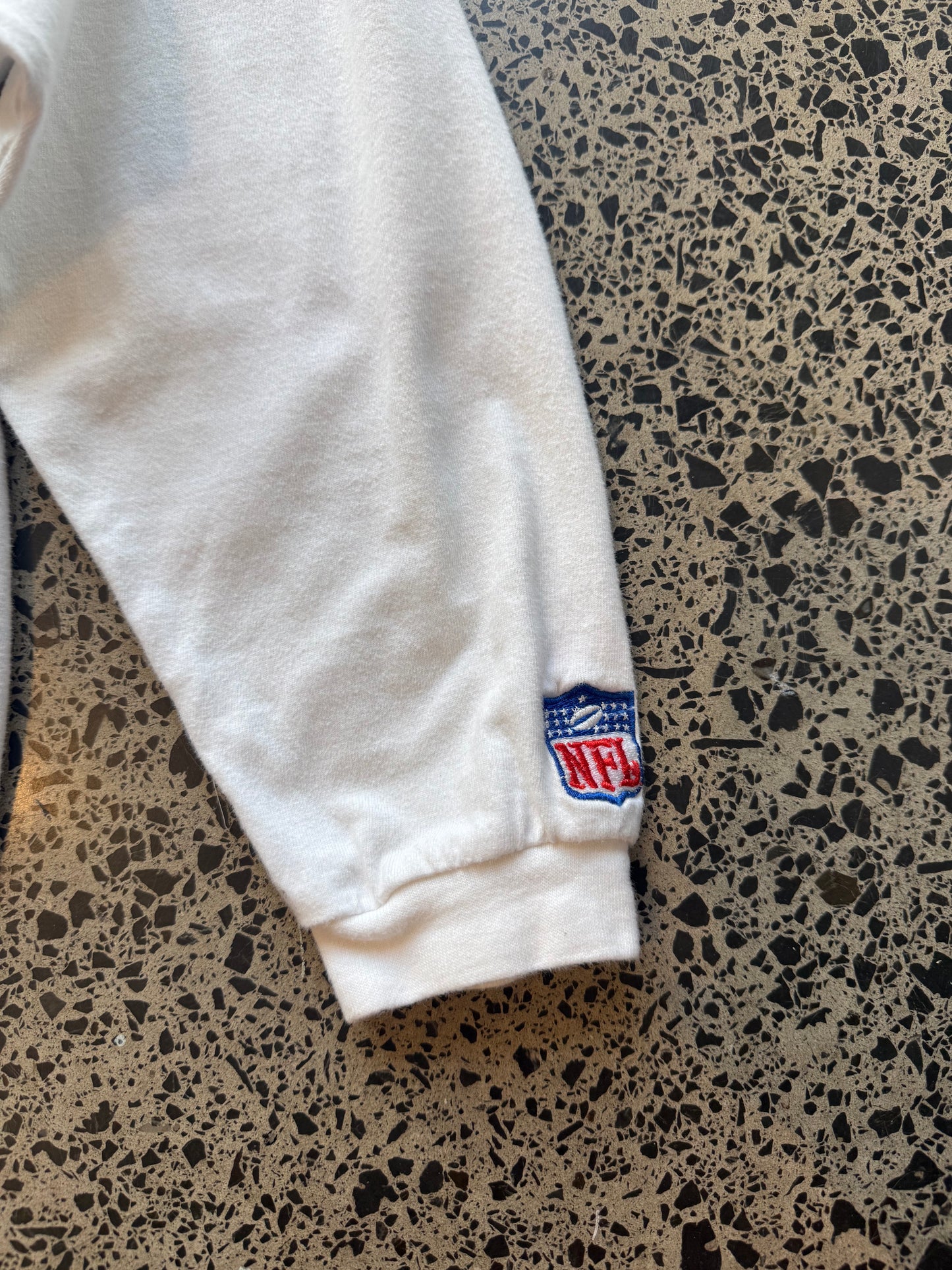 90s Miami Dolphins NFL long sleeve shirt 2XL laid flat on polished concrete background, vintage football tee with team colors and bold graphics.