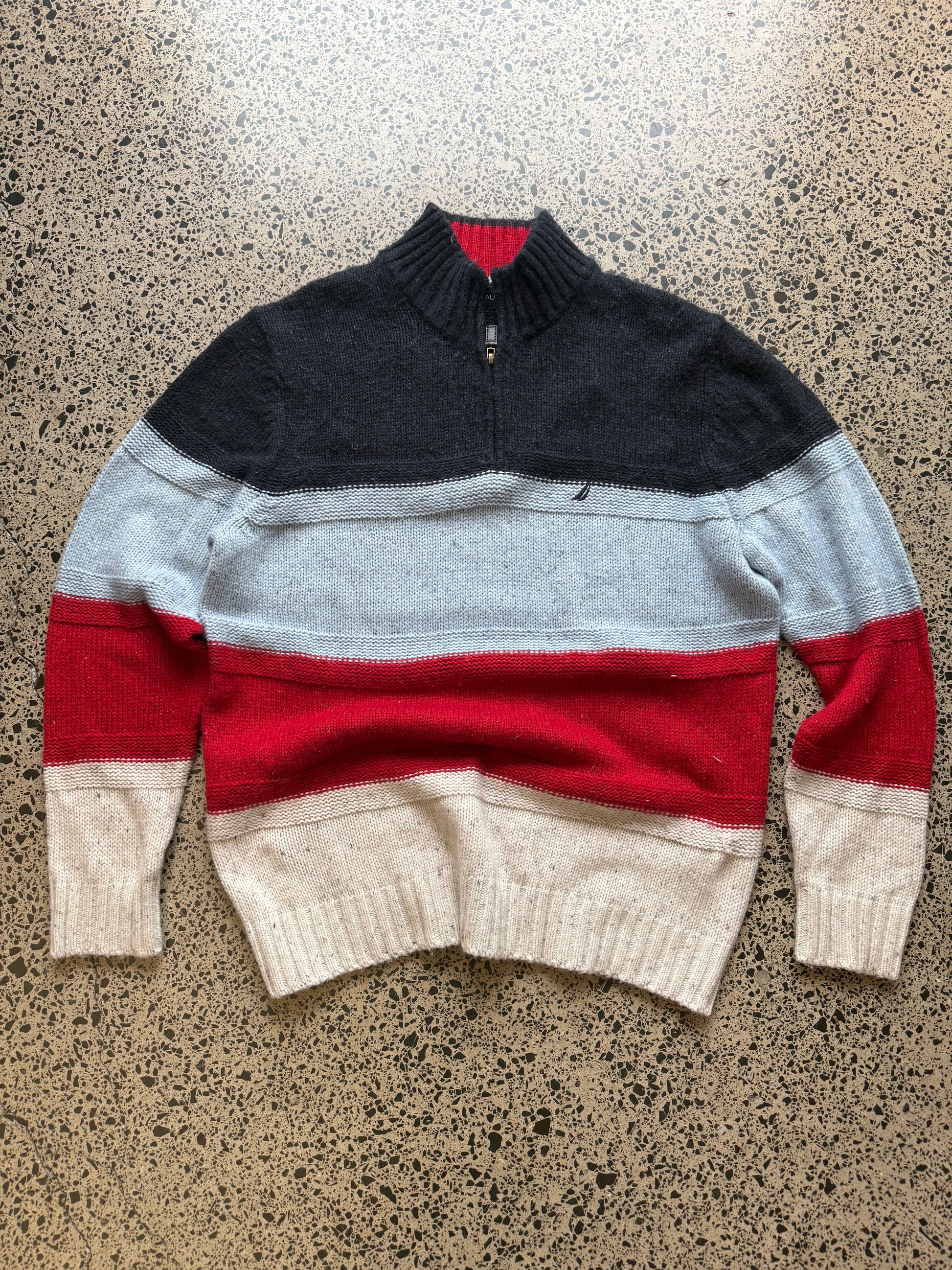 Nautica 1/4 zip knit jumper XL laid flat on polished concrete background, vintage knit sweater with quarter zip collar and relaxed fit.