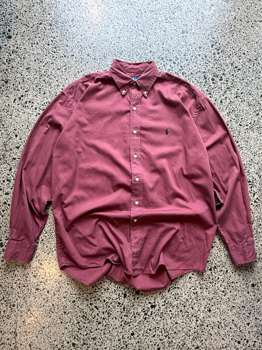 Ralph Lauren button-up shirt size XL laid flat on polished concrete background, classic designer shirt with clean styling and relaxed fit.