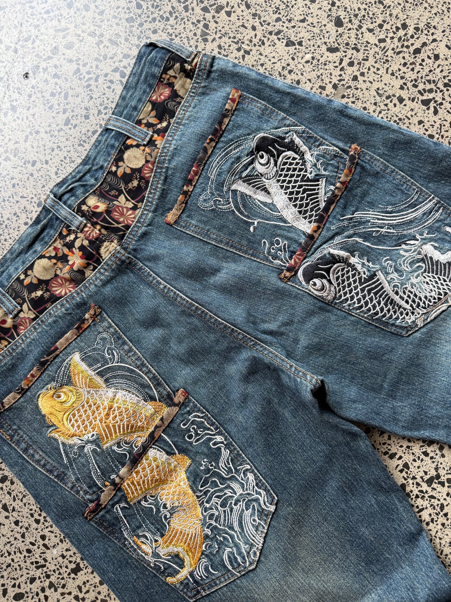 Dominate handcrafted embroidered denim jeans with koi fish, waves, and sakura design. W36 L33 vintage streetwear