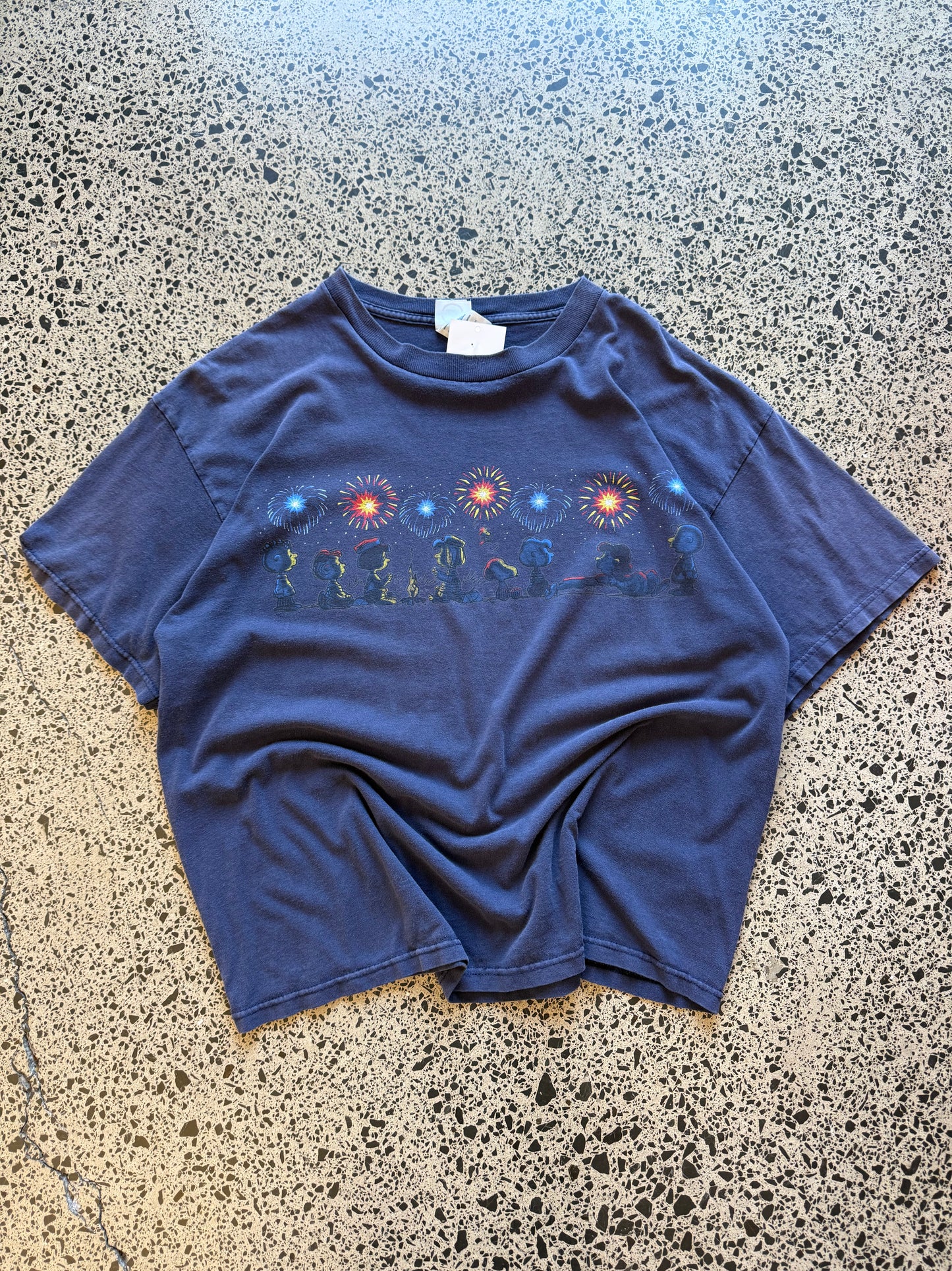 Vintage Y2K Peanuts black t-shirt featuring bold, colourful Snoopy and friends graphic. Size XL. Nostalgic comic strip tee