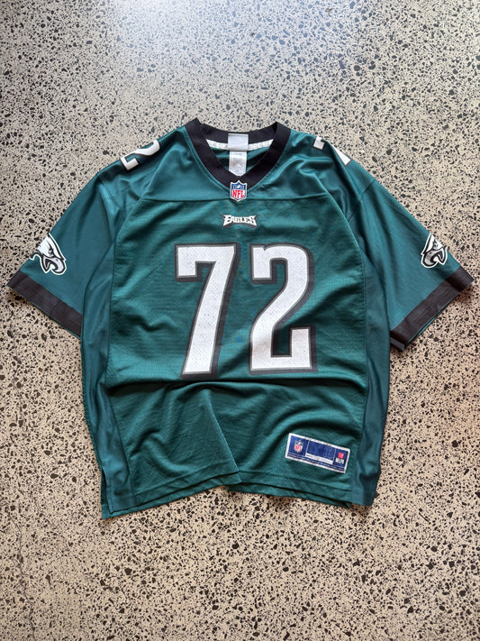 Philadelphia Eagles Halapoulivaati Vaitai NFL jersey size L laid on polished concrete background — midnight green with white detailing and Eagles logo.