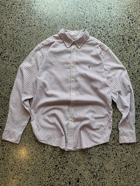 Pinstripe Ralph Lauren button-up shirt size L laid flat on polished concrete background, classic designer shirt with subtle stripe pattern and relaxed fit.