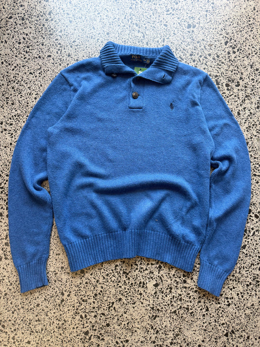 2014 Ralph Lauren Polo knit jumper size S laid flat on polished concrete background, classic knit sweater with embroidered Polo logo and clean fit.