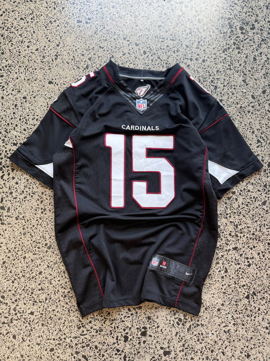 Arizona Cardinals Michael Floyd NFL jersey size L laid on polished concrete background — red with white detailing and Cardinals logo.