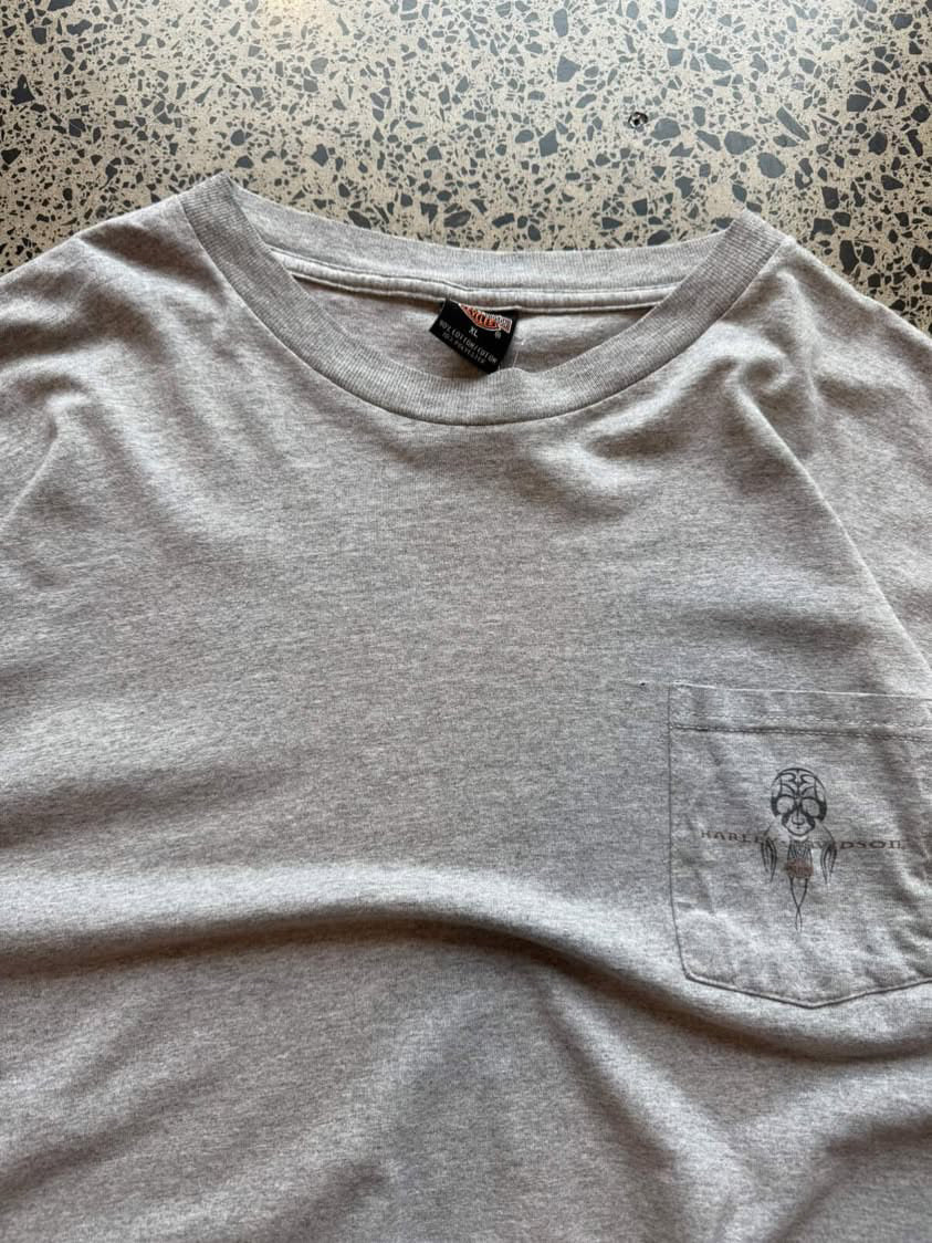 Harley-Davidson graphic T-shirt in size L laid flat on a polished concrete background featuring bold motorcycle-inspired branding