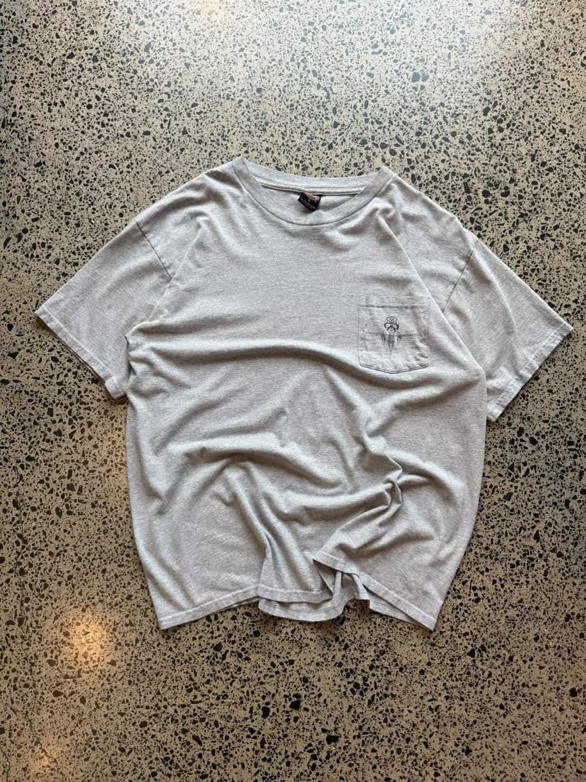 Harley-Davidson graphic T-shirt in size L laid flat on a polished concrete background featuring bold motorcycle-inspired branding